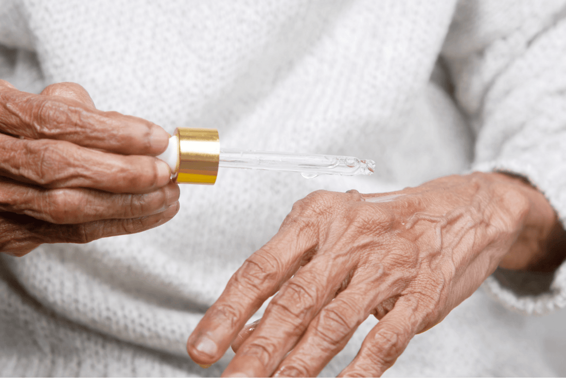 Woman holding a tube of liquid