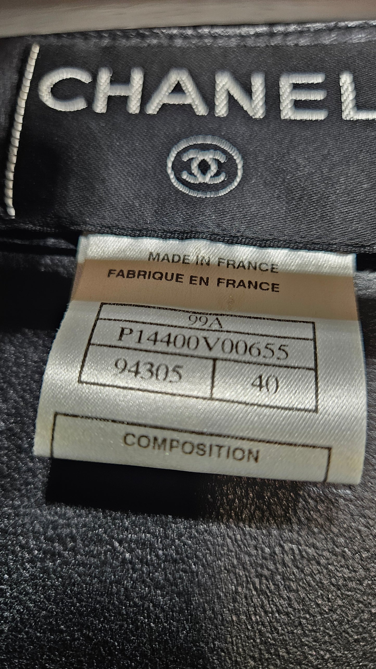 Chanel label on a garment with visible branding and text.