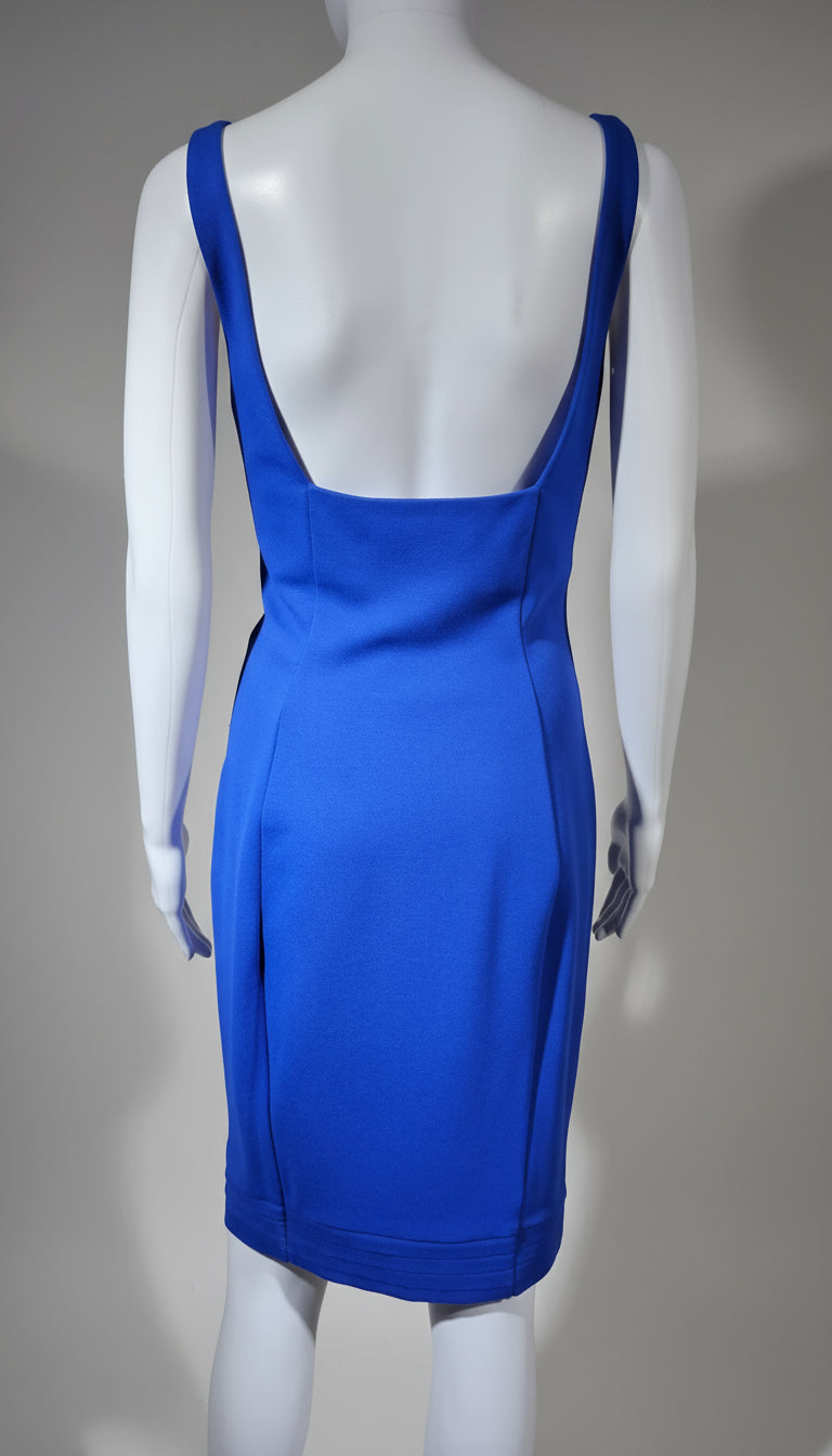 Blue dress on a mannequin against a gray background