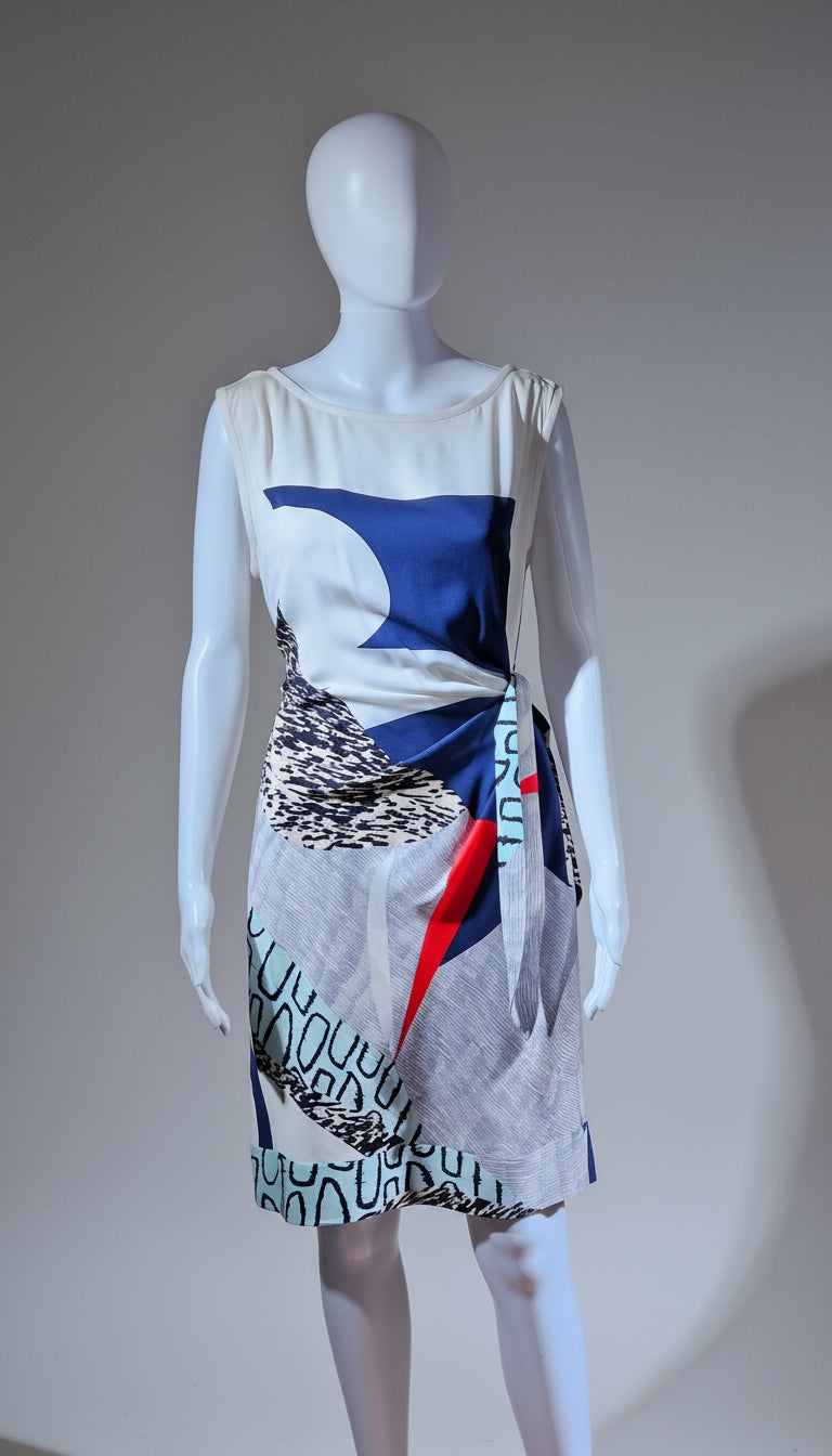 Mannequin wearing a dress with a colorful abstract pattern on a plain background