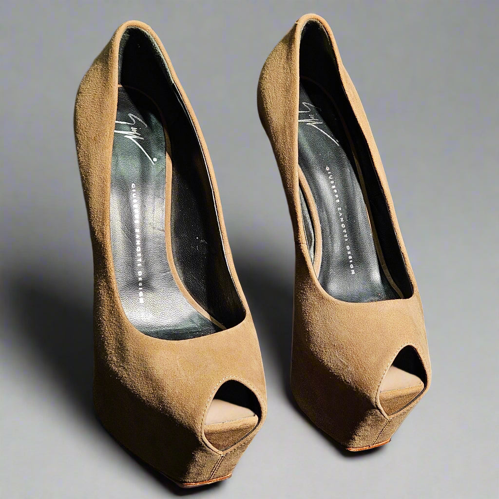 Pair of brown open-toe high-heeled shoes on a gray background