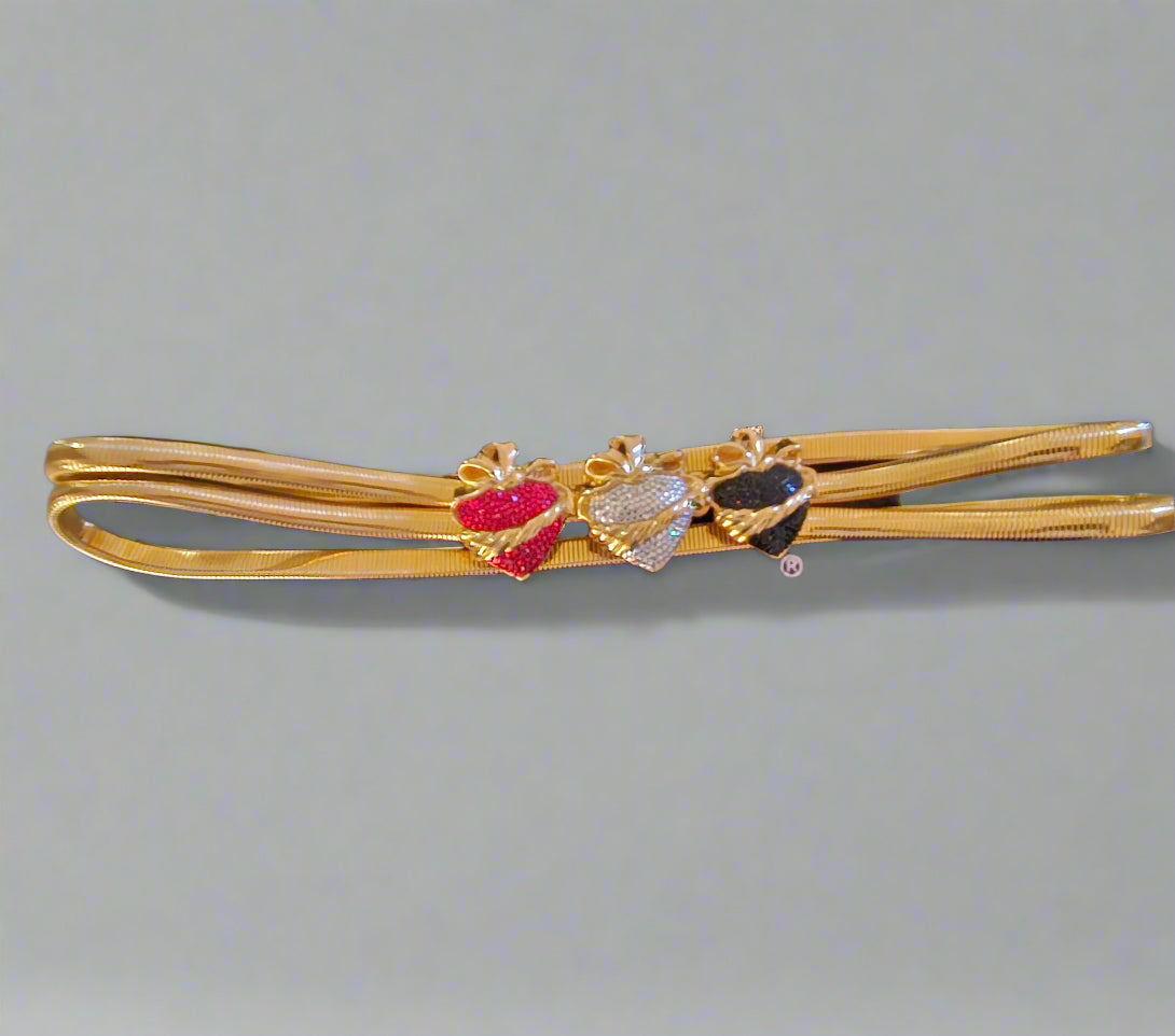 Gold belt with colorful stones on a gray background