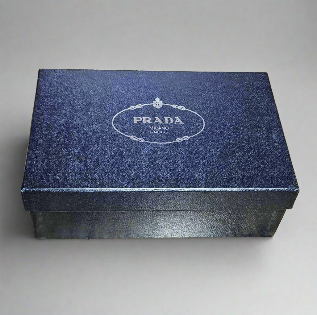 Blue Prada box on a gray background