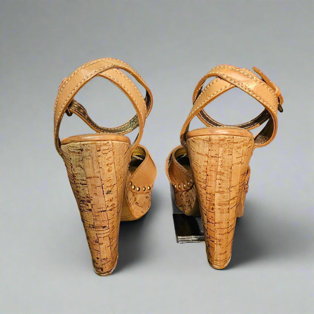 Pair of ancient sandals on a black background