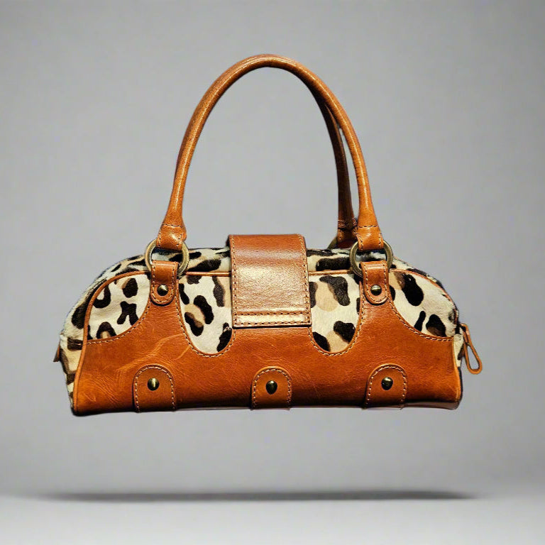 Brown handbag with leopard print pattern on a gray background