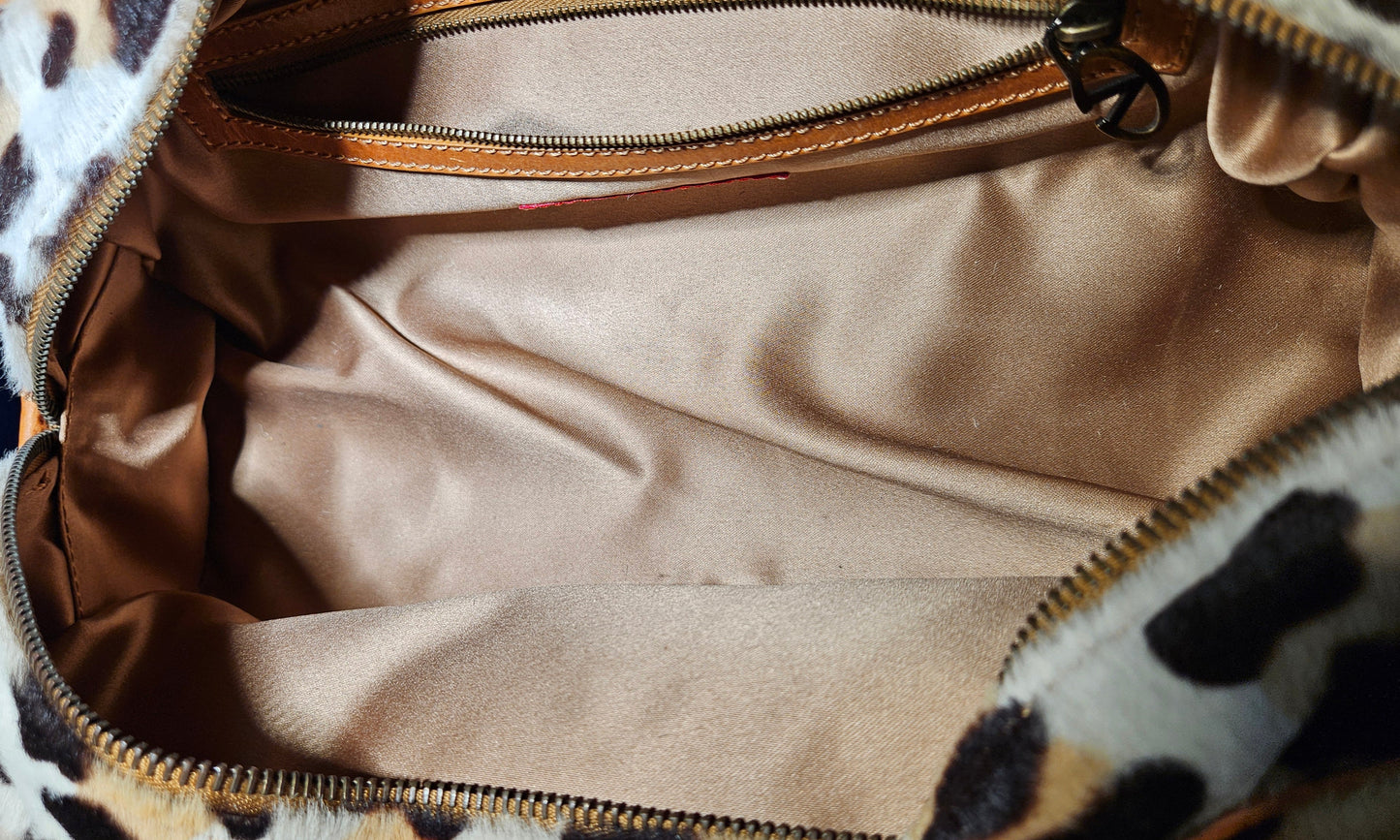 Leopard print handbag with beige interior