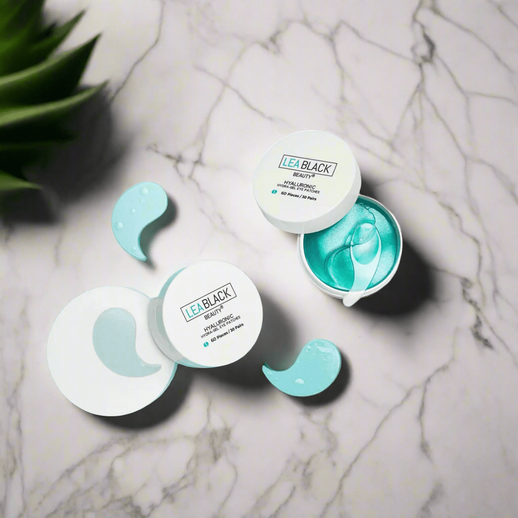 Two open containers of Lea Black Beauty® Hyaluronic Hydra-Gel Eye Patches