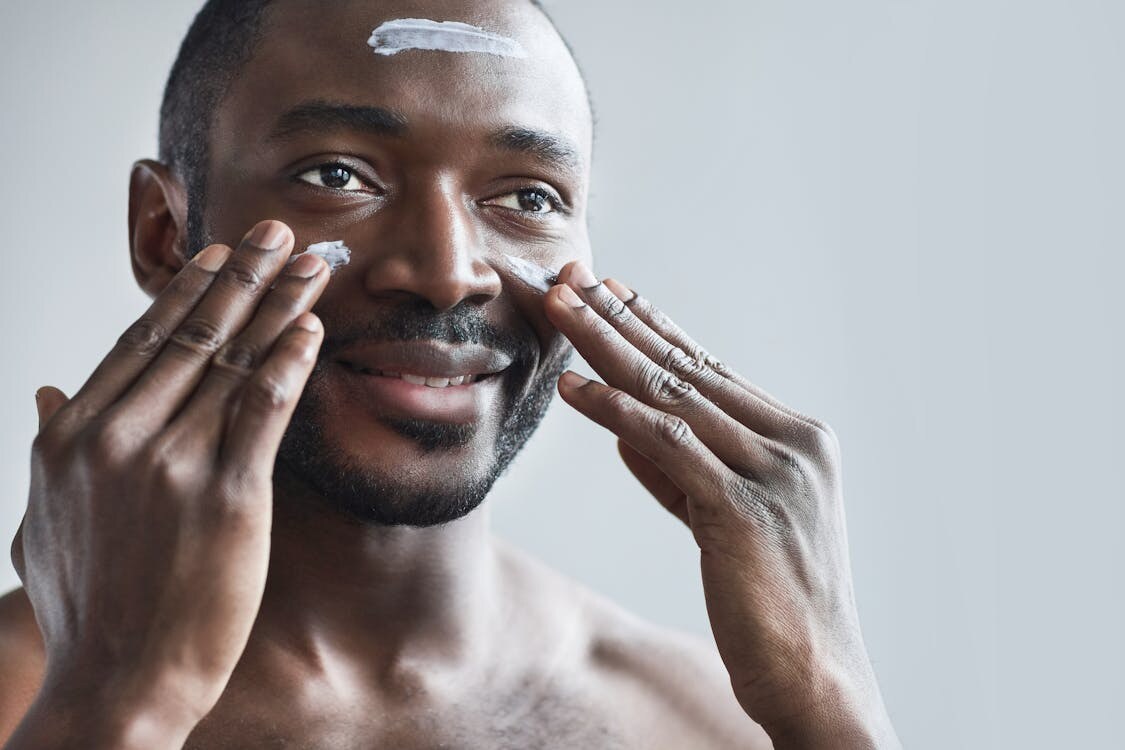  A man doing a basic skincare routine for men