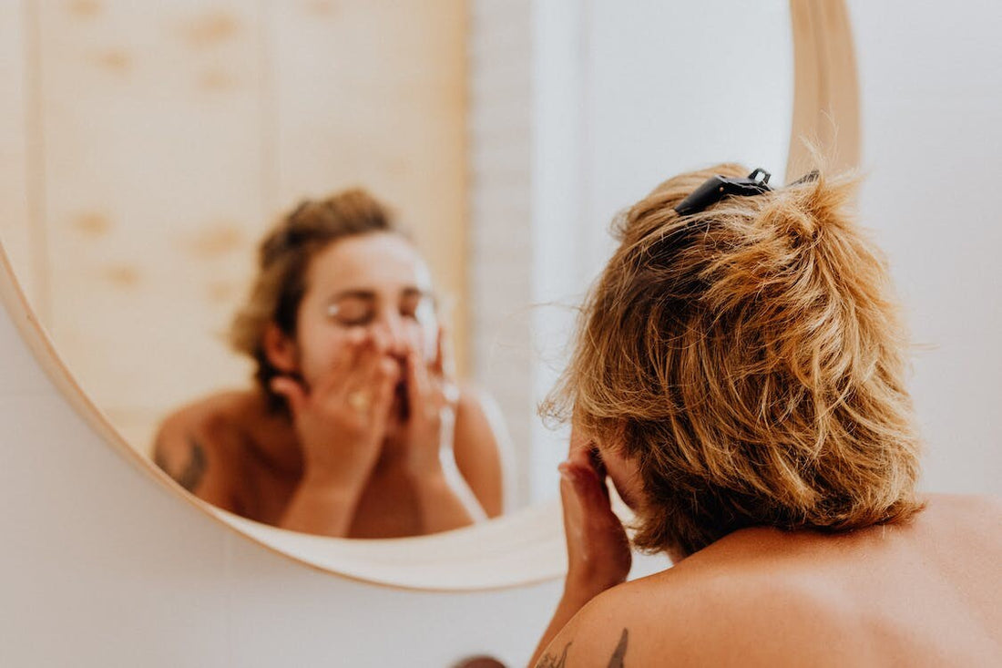 A woman washing her face