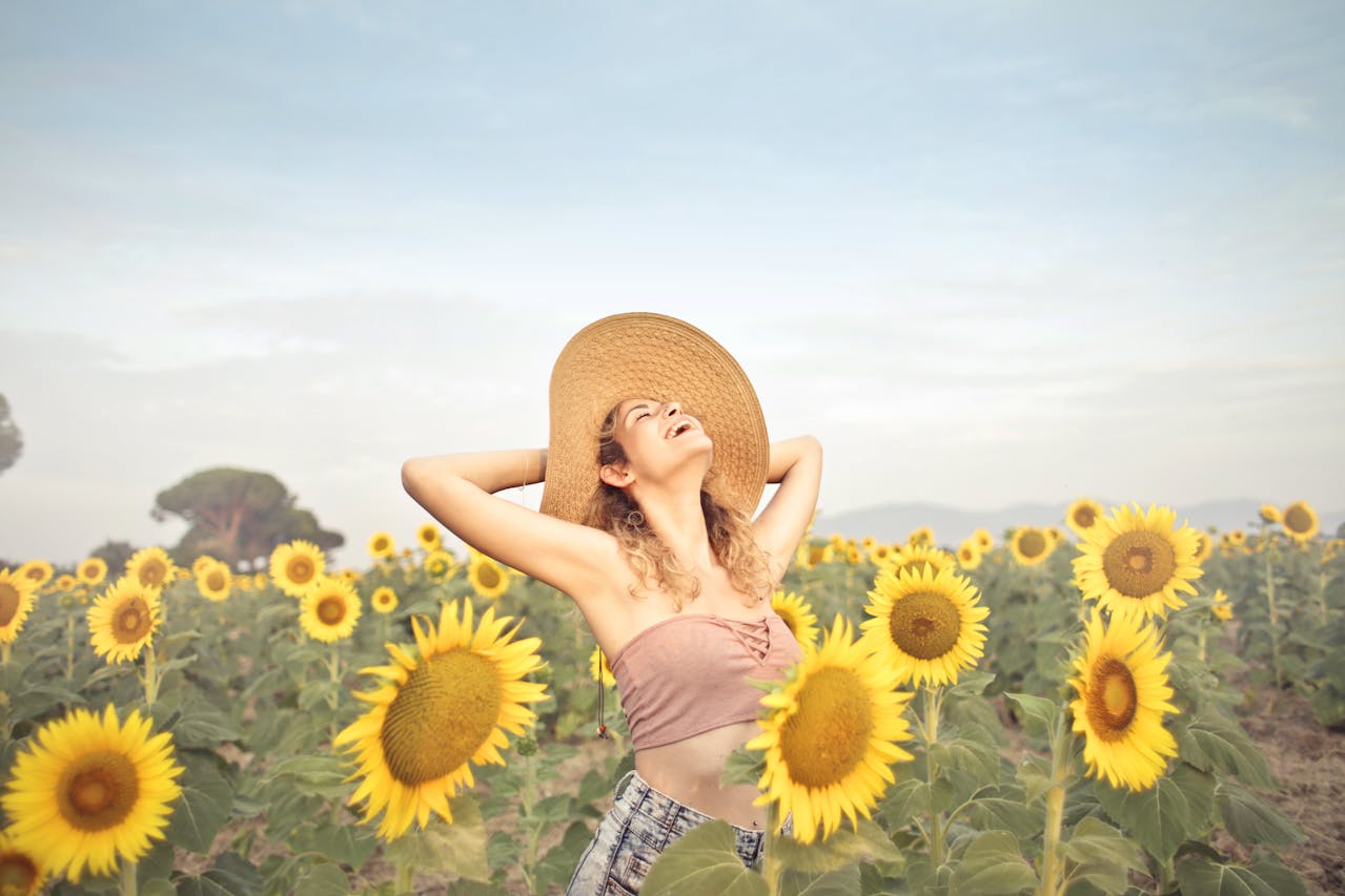 Woman in a sunflower field during summer
