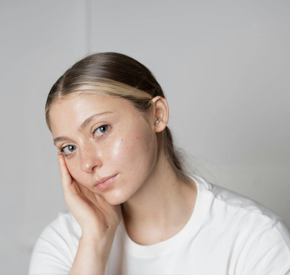 A woman with a dewy dolphin skin