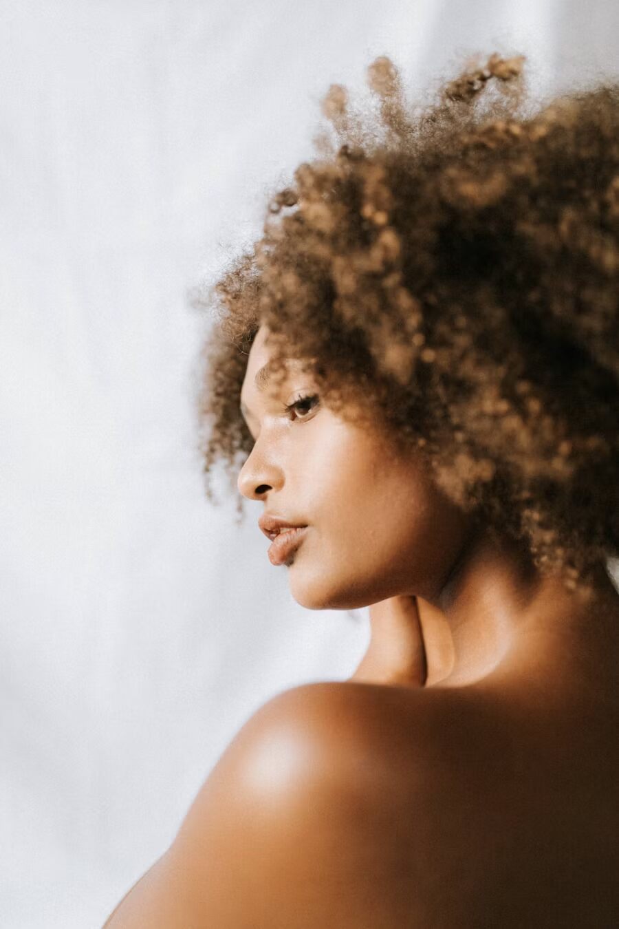 a young woman with curly hair