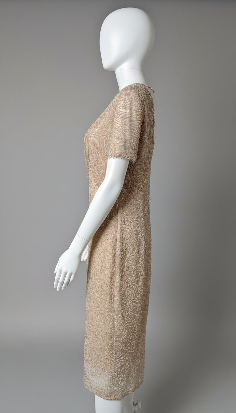 Beige dress on a white mannequin against a gray background