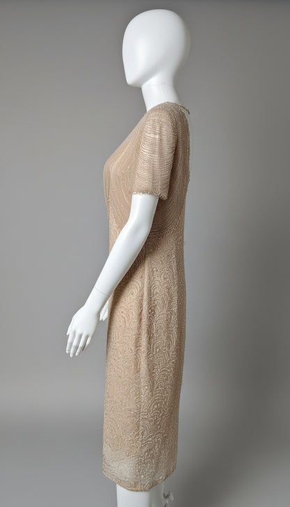 Beige dress on a white mannequin against a gray background