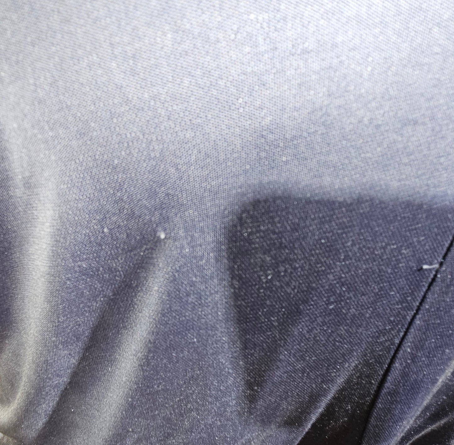 Close-up of a textured gray fabric surface