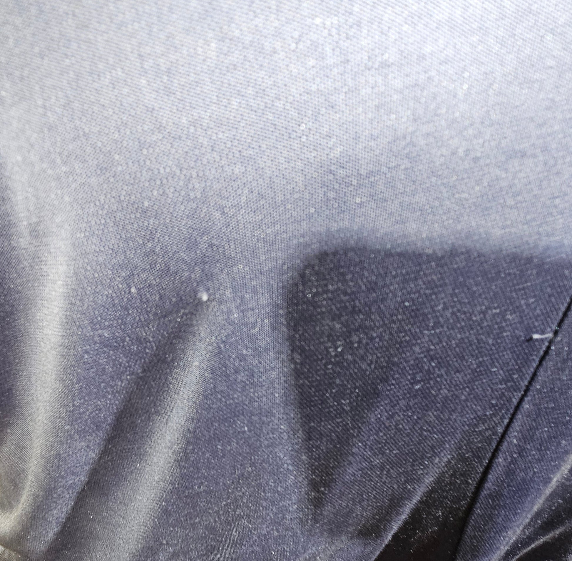 Close-up of a textured gray fabric surface