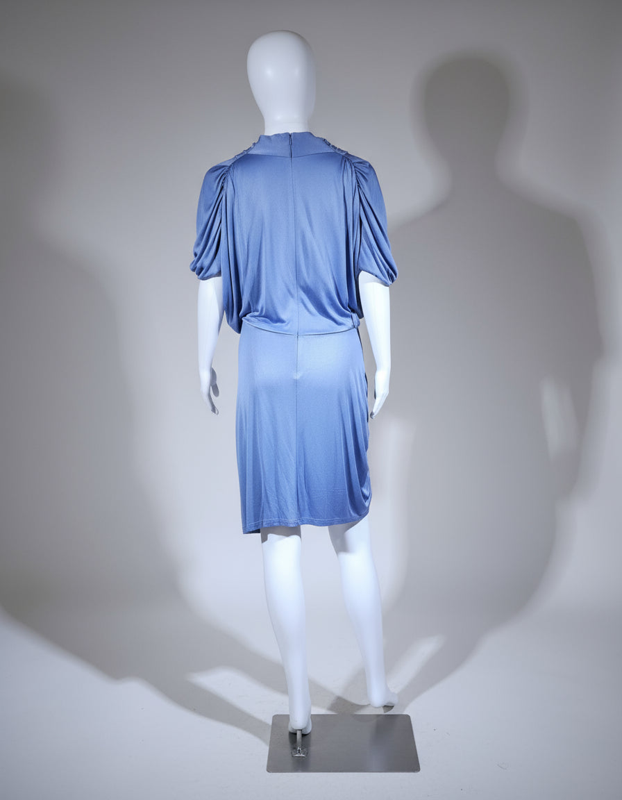 Mannequin wearing a blue grey dress against a white background