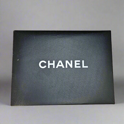 Chanel box with a black interior on a cardboard base