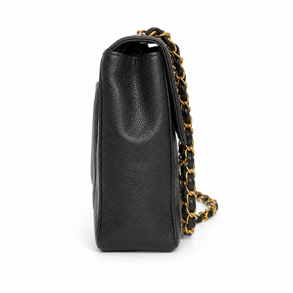 Black leather handbag with a gold chain strap on a white background