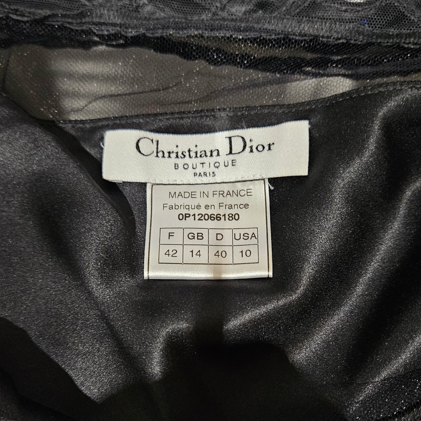 Close-up of a Christian Dior label on black fabric
