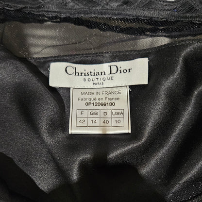 Close-up of a Christian Dior label on black fabric