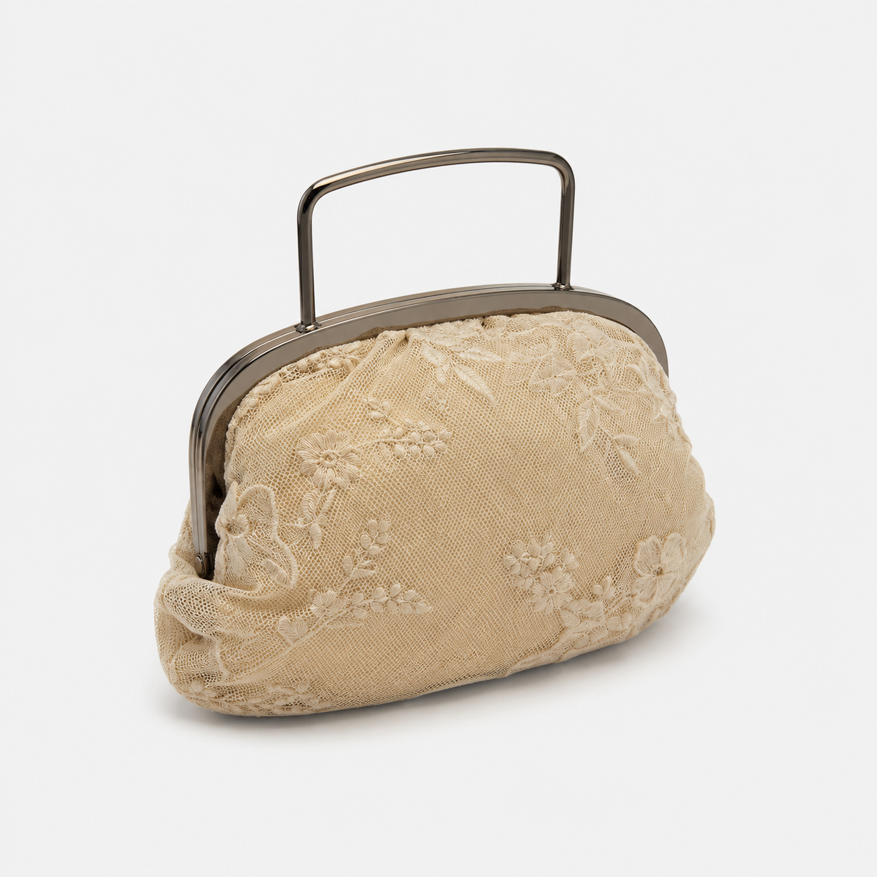 Beige lace handbag with a metal frame on a white background