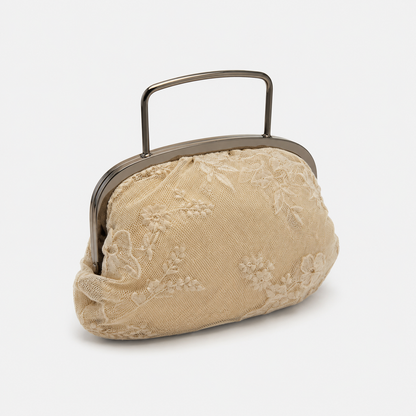 Beige lace handbag with a metal frame on a white background