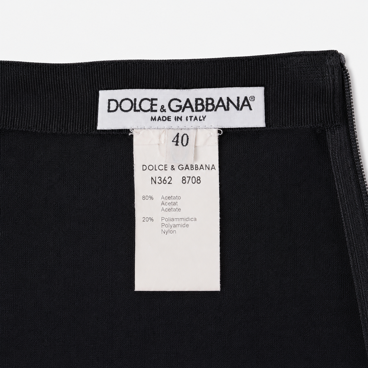 Dolce & Gabbana label on a black garment with size 40 and material information.