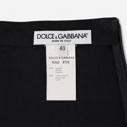Dolce & Gabbana label on a black garment with size 40 and material information.