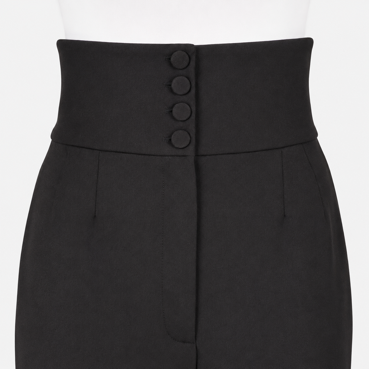 Black pants with four button detail closure on a white background