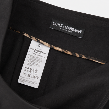 Dolce & Gabbana label on a black garment with a leopard print trim.