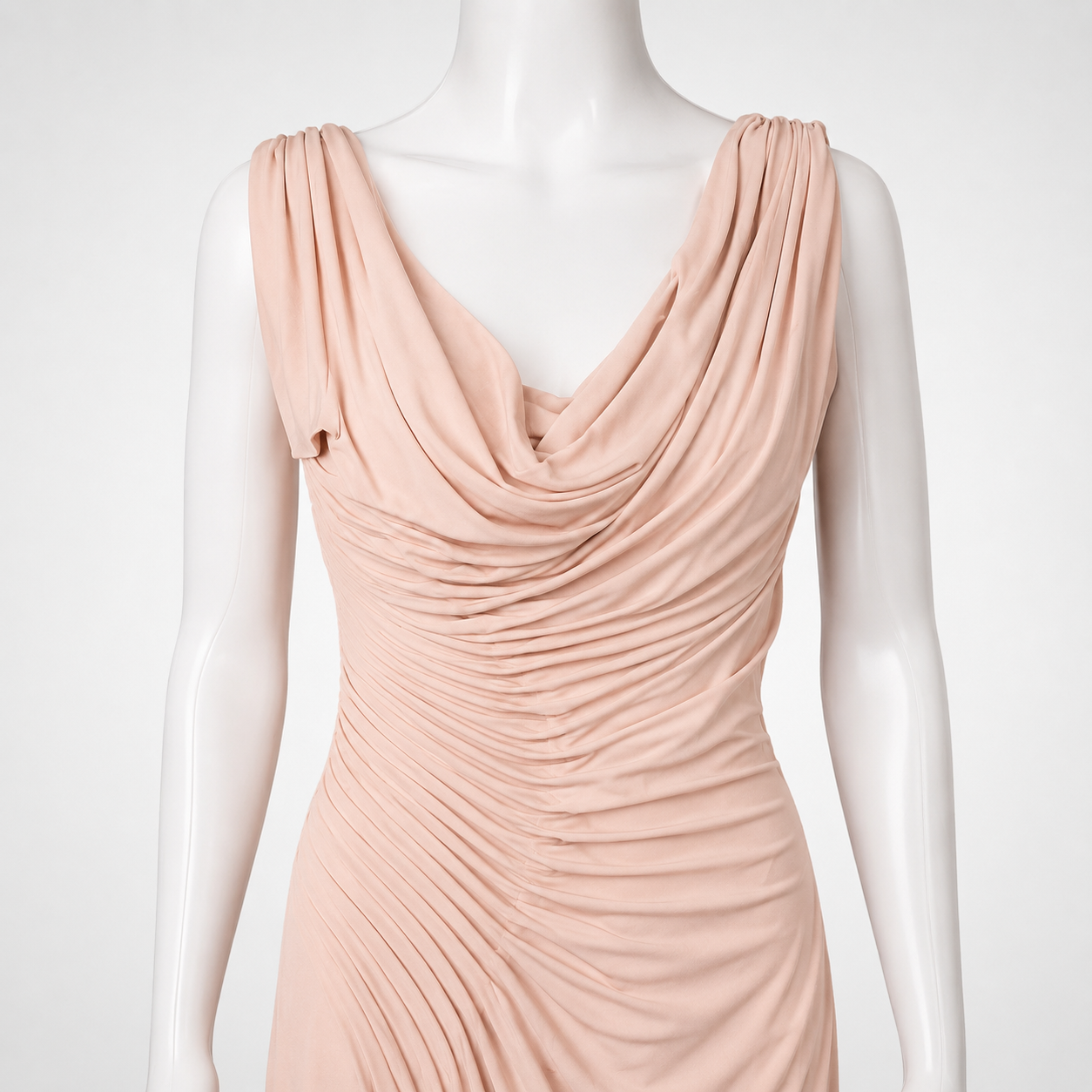Pink evening gown on a mannequin against a white background