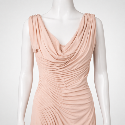 Pink evening gown on a mannequin against a white background