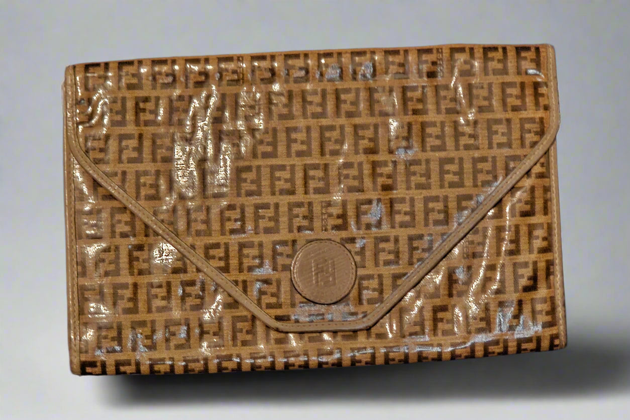 Brown textured clutch bag with a logo on a light gray background