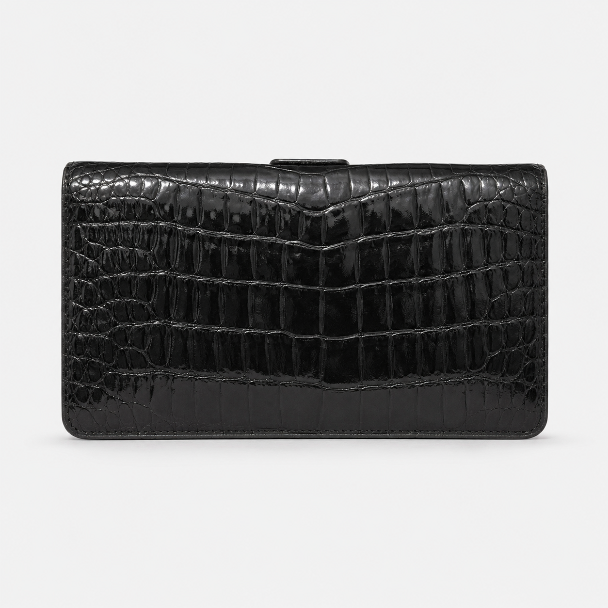 Black crocodile-patterned handbag on a white background