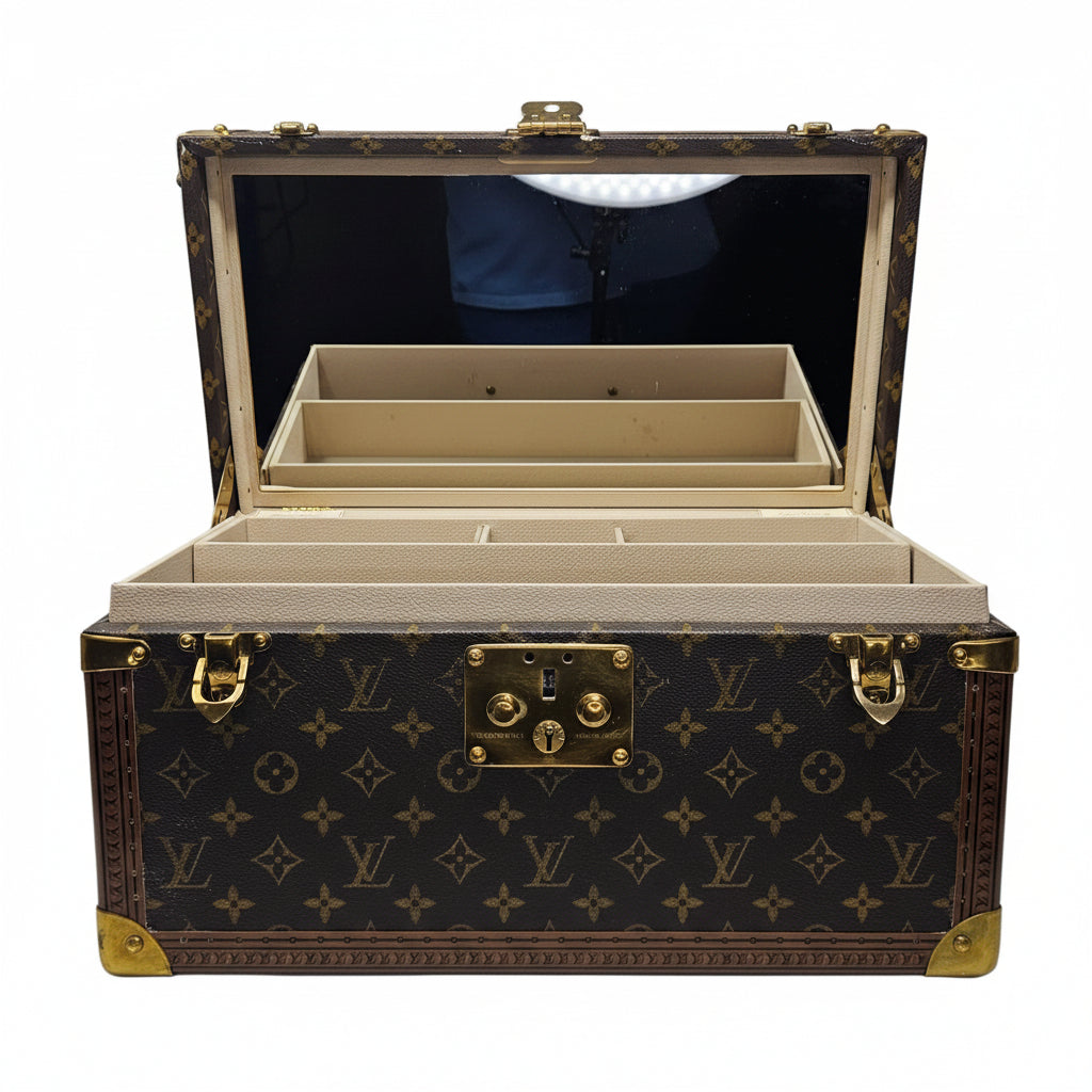 Open Louis Vuitton Vanity  box with monogram pattern on a white background