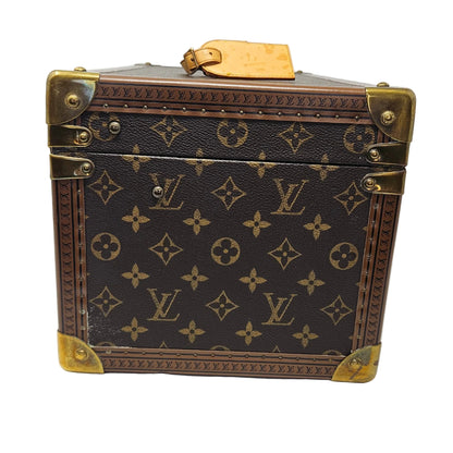 Louis Vuitton suitcase with monogram pattern on a white background