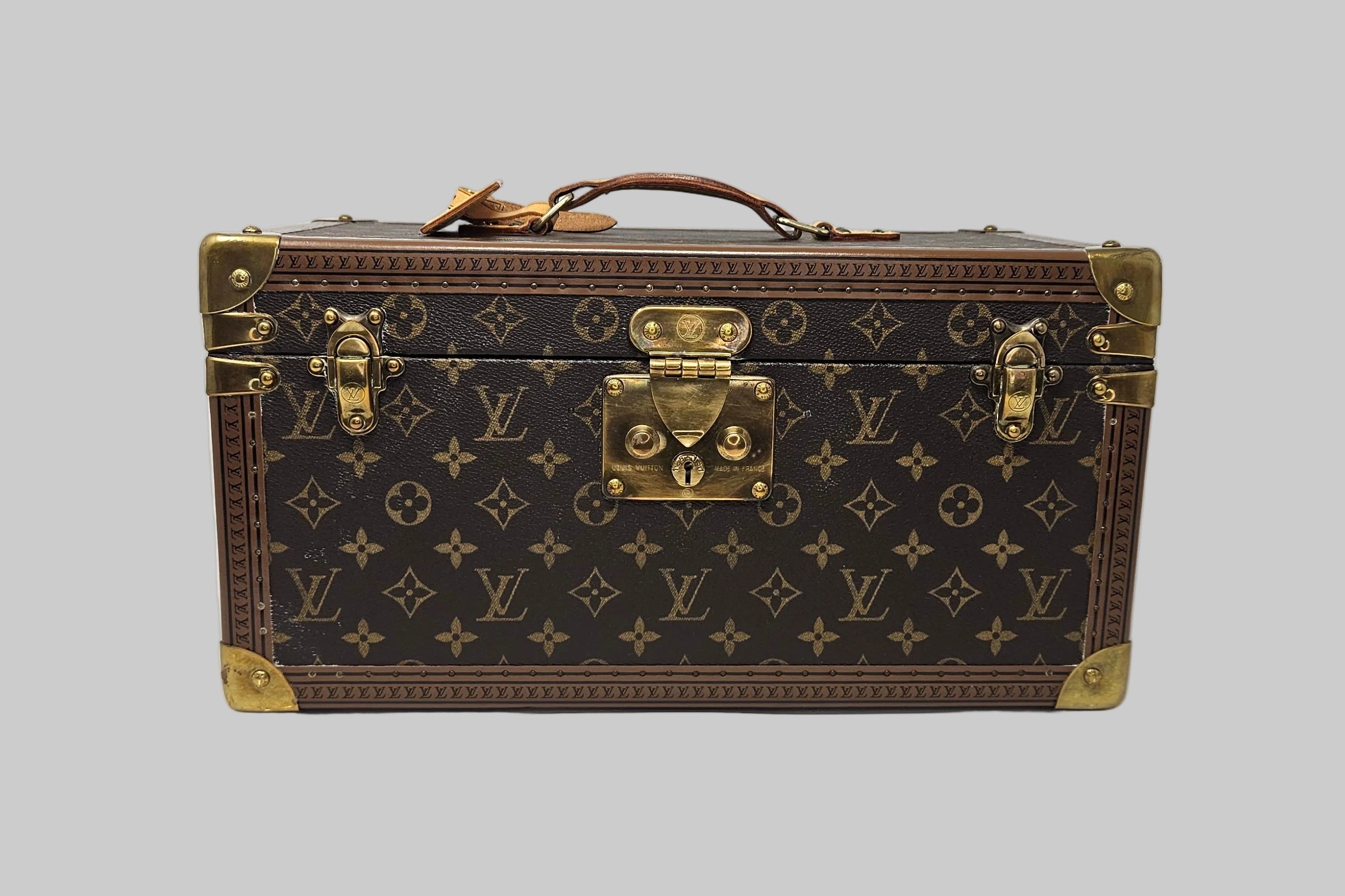 Louis Vuitton monogram suitcase on a white background