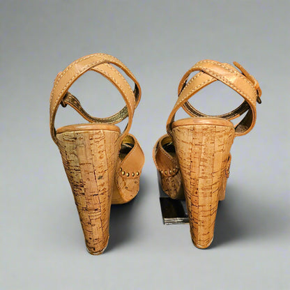 Pair of ancient sandals on a black background