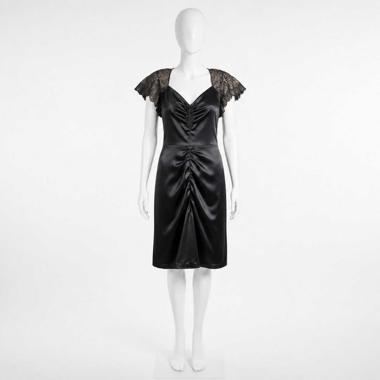 Black satin dress with lace sleeves on a mannequin against a white background