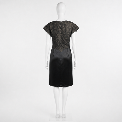 Black dress on a mannequin against a white background