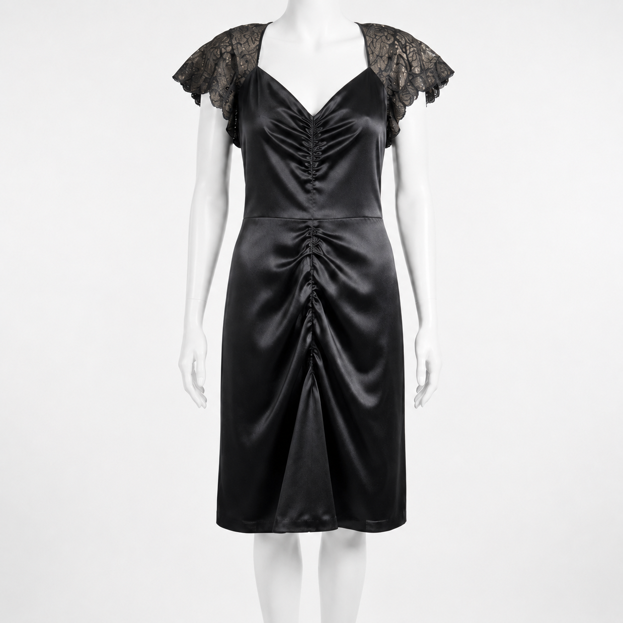 Black satin dress with lace sleeves on a mannequin against a white background
