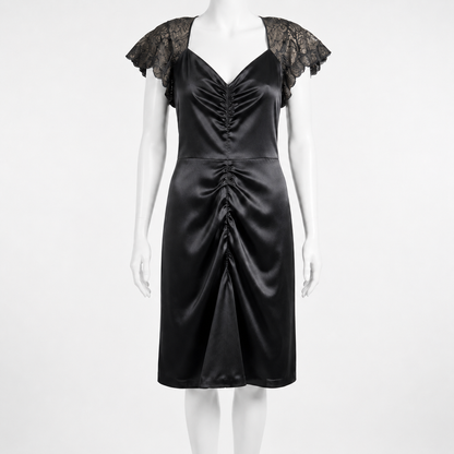 Black satin dress with lace sleeves on a mannequin against a white background