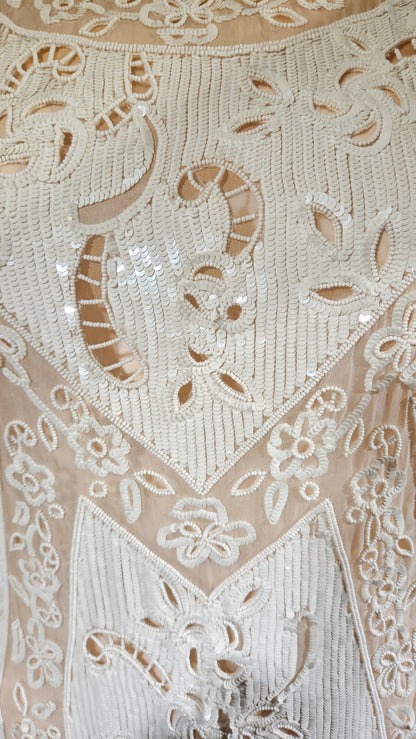 Close-up of intricate lace fabric with floral adesigns.