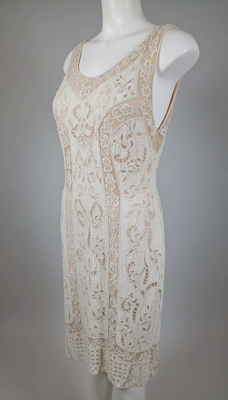 Lace dress on a mannequin against a gray background