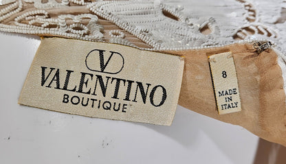 Valentino Boutique label on a garment with 'Made in Italy' tag.