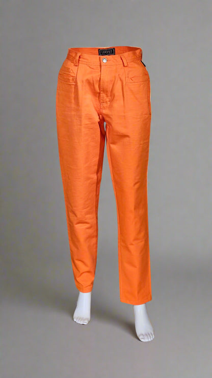 Orange pants displayed on a mannequin against a neutral background