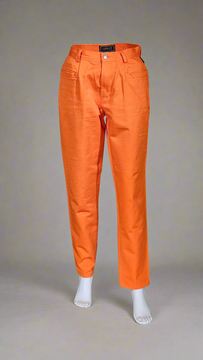 Orange pants on a neutral background
