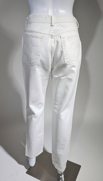 White pants on a mannequin against a plain background