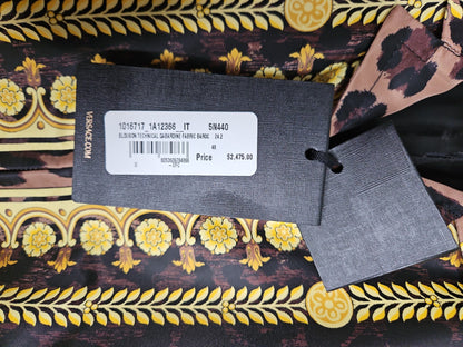 Versace label on a patterned fabric background